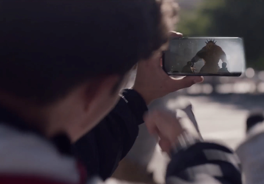 A gamer lines up his shot at a giant monster displayed via Augmented Reality on his Samsung Galaxy device.