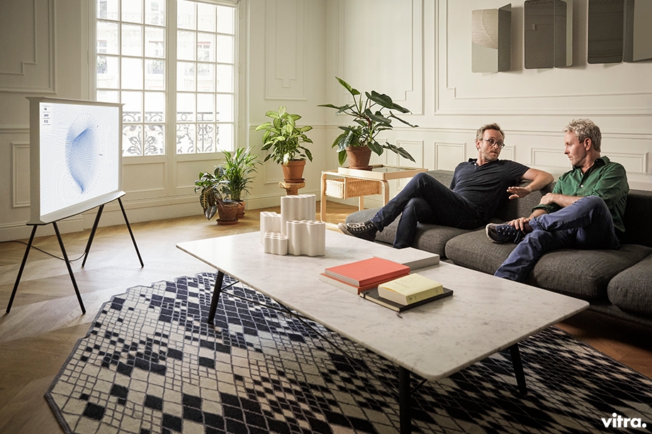 Designers of The Serif, Bouroullec brothers in a Showroom Vitra France. Vitra logo on the bottom right of the image