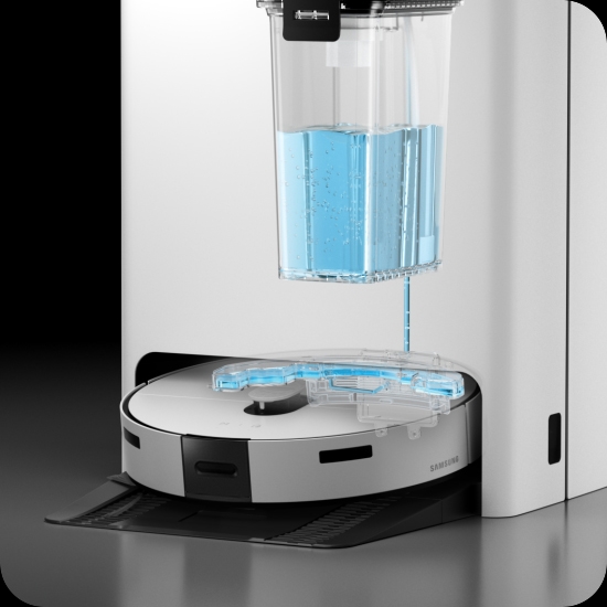 White Jet Bot Robot Vacuum & Mop Combo being refilled in the all in one cleaning station