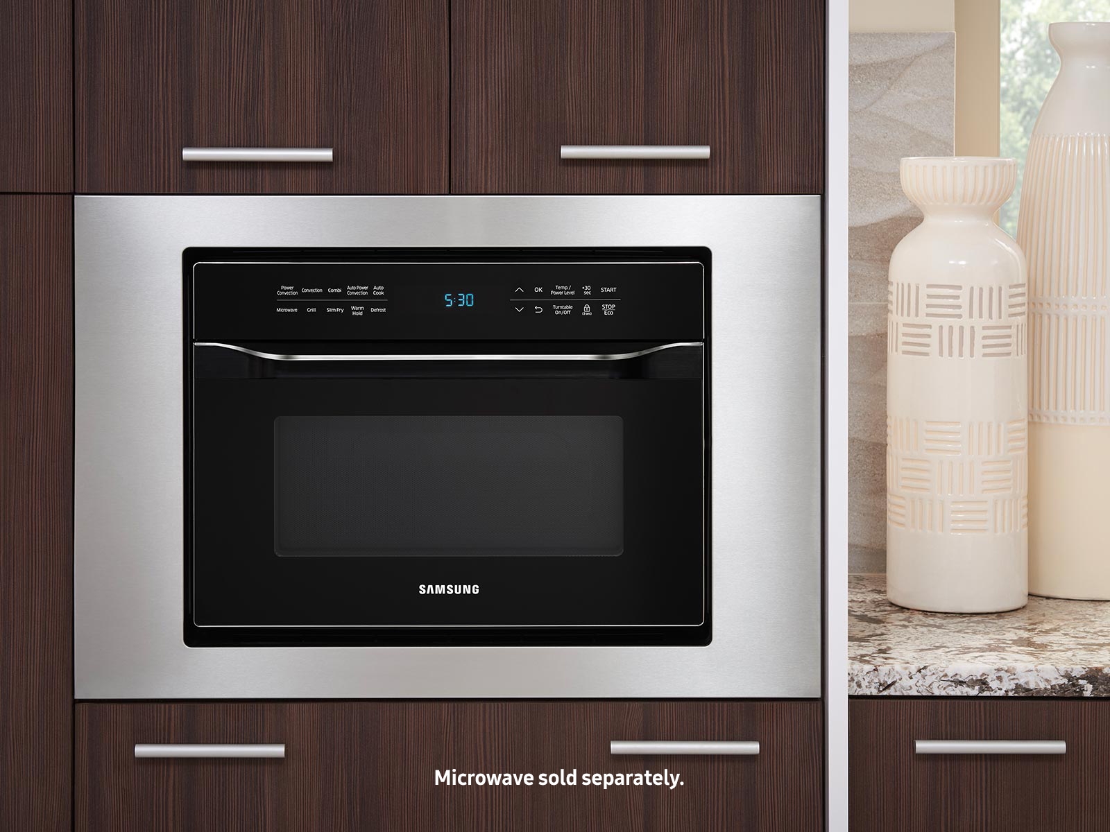 https://image-us.samsung.com/SamsungUS/home/home-appliances/home-appliances-accessories/microwaves/pd/ma-tk3080ct/04_Microwave_Countertop_Lifestyle_MC12J8035CT_Trim_Kit_MA-TK3080CT_Closed_Silver.jpg?$product-details-jpg$