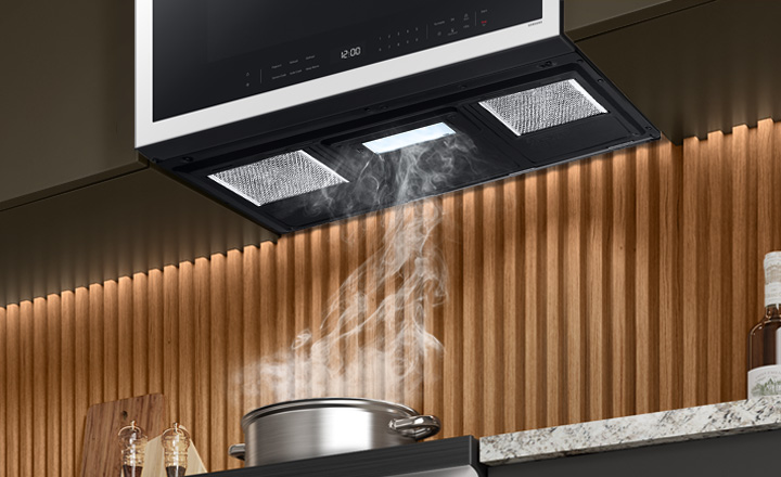 Pot boiling with steam going into Samsung Over the Range vent