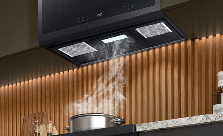 Pot boiling with steam going into Samsung Over the Range vent