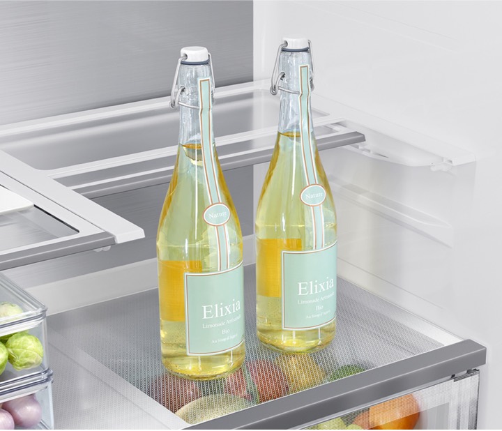 Close up of 23 cubic feet refrigerator shelf storing tall bottles