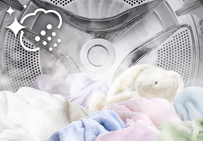Clothes and toys inside Samsung washer dryer combo using steam to remove stains