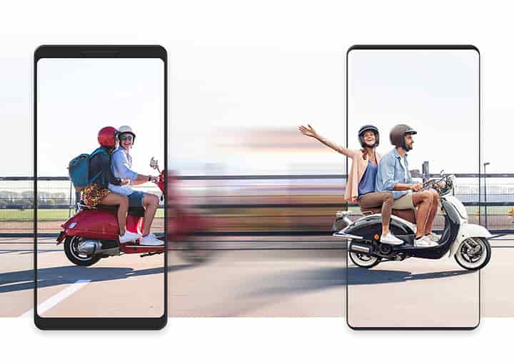 Data transfers quickly and easily from your old device to a new Galaxy, represented by a pair of scooters zooming from left to right, one framed by the simulated bezels of an old device and another framed by the shape of a new Galaxy device. Between the two vehicles is a blurred motion effect, indicating speediness.