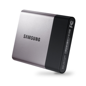 Samsung portable drive surrounded by a tablet, phone, and game controller