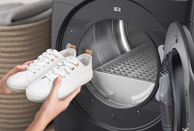 Person using the dryer rack in the Samsung dryer