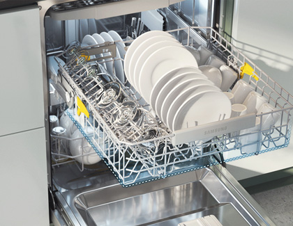 Samsung dishwasher filled with ceramic plates and glass cups