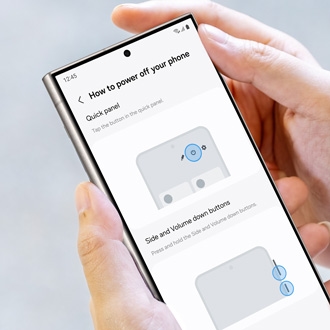 Hand holding a Galaxy phone displaying a tutorial on how to power off the phone using the quick panel and side volume buttons
