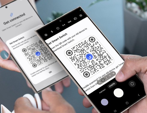 Two hands holding Galaxy phones, one scanning a QR code from the other's screen to use the Smart Switch feature for device setup