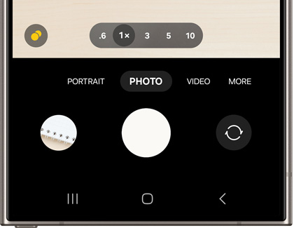 Galaxy phone camera interface with settings for zoom levels and modes such as PORTRAIT, PHOTO, VIDEO, and MORE
