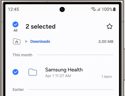 Screen of a Samsung phone showing two selected files in the Downloads folder, including a Samsung Health file, ready to be managed or deleted.