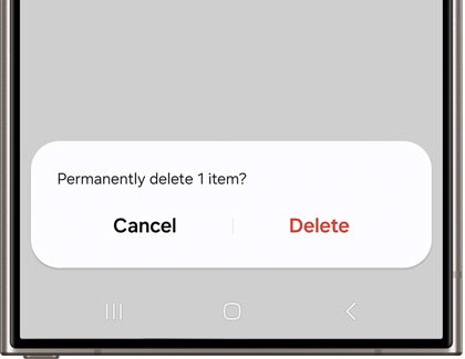 Confirmation pop-up on a Samsung phone asking to 'Permanently delete 1 item?' with options to cancel or delete.