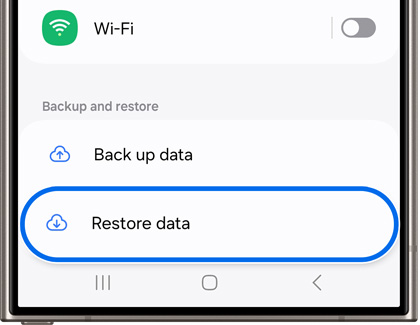 Backup and restore options on a Samsung phone screen, highlighting the 'Restore data' button under Wi-Fi settings.