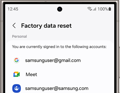 Galaxy phone screen showing 'Factory data reset' settings with a list of signed-in accounts including Gmail and Samsung email, indicating readiness for reset.