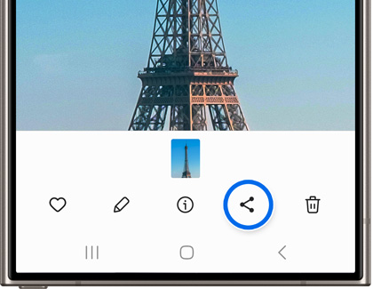 Galaxy phone screen displaying an editing toolbar for a video with the Eiffel Tower, featuring icons for liking, editing, sharing (highlighted), and deleting.