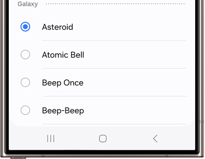 List of ringtone options on a Galaxy phone's screen, with 'Asteroid' selected and other choices like 'Atomic Bell' and 'Beep Once' available.