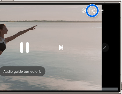 Galaxy phone playing a video with the Audio guide icon highlighted and turned off