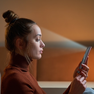 Woman registering her face in Facial Recognition Security on a Galaxy phone