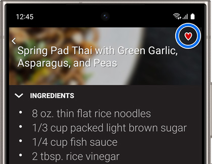 A recipe and ingredients list with a heart icon highlighted in the upper right of the Chef Collection app on a Galaxy phone