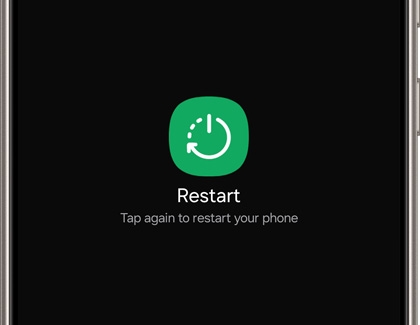 Galaxy phone screen showing a 'Restart' button with a power icon in a green circle. The text below the button instructs, 'Tap again to restart your phone'.