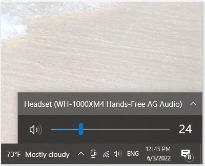 Volume control interface on a PC showing the connection to a 'Headset (WH-1000XM4 Hands-Free AG Audio)' with the volume level set at 24.