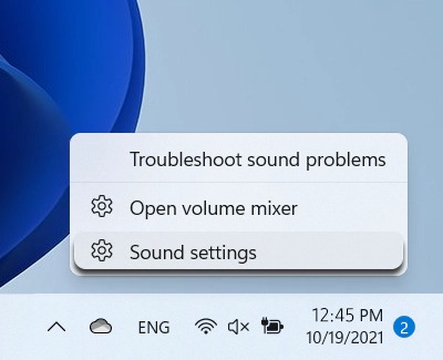 Context menu for troubleshooting sound problems on a PC, with options to open the volume mixer and access sound settings, displayed over a taskbar with system icons.