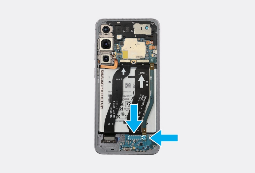 Arrows indicating where to press down and secure the sub flex cable to the charging port board.