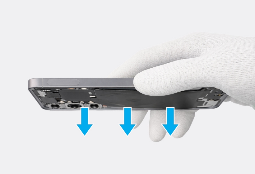 Gloved hand holding the phone with blue arrows pointing downward to the back cover.