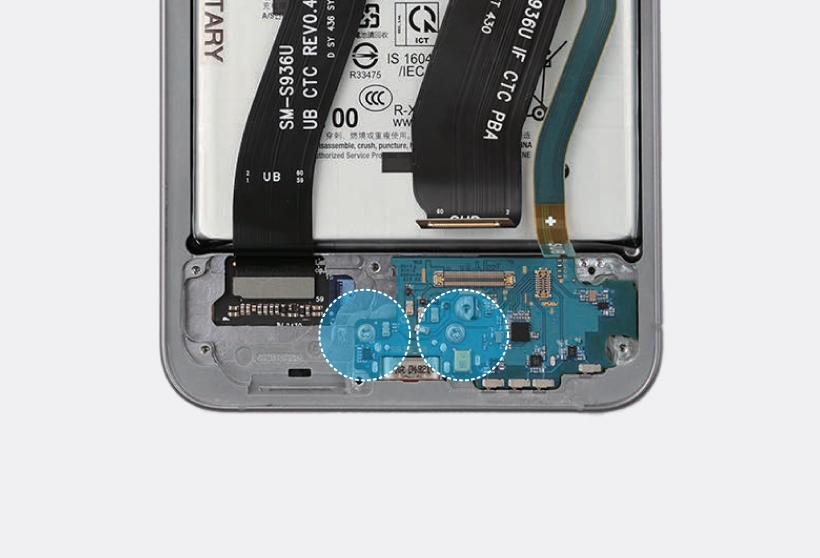 Internal view of S25 Plus with blue circles highlighting two screws on the charging port board.