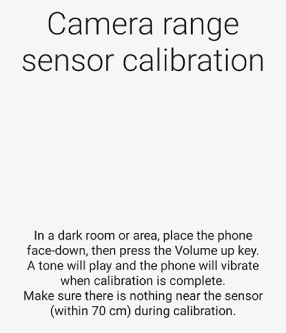 Camera range sensor calibration screen showing instructions for placing the phone face-down to begin calibration.