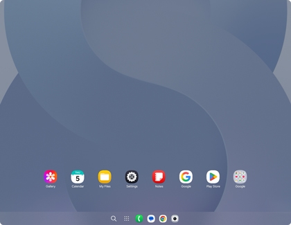 A Samsung DeX desktop interface showing a clean wallpaper with a taskbar at the bottom containing several pinned quick-access app icons.
