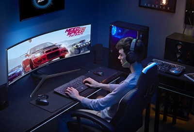 Teenager playing racing game on a Samsung PC