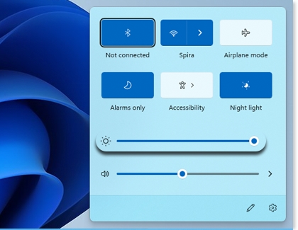 Brightness slider highlighted in the Quick Settings panel