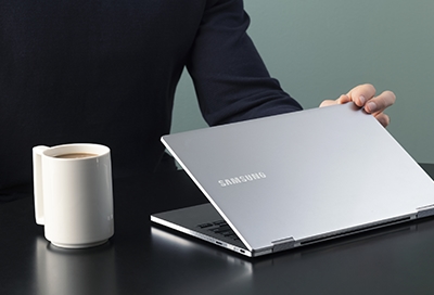 Person using a Samsung Galaxy Book laptop on their lap