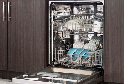 Loaded Samsung dishwasher with the door open