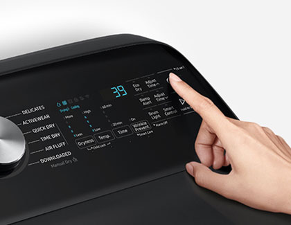 A person tapping the icons on a Samsung dryer.