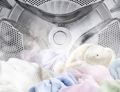 Close-up of the Samsung Bespoke washer drum with steam gently cleaning delicate fabrics and toys.