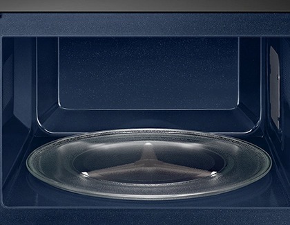 A turntable inside a blue Samsung microwave