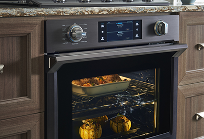 Samsung slide in range with food cooking inside