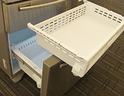 Freezer drawer being removed