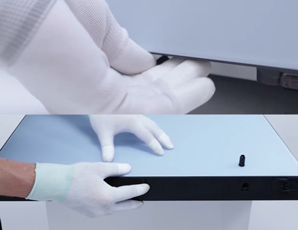 Person putting bottom clips to secure the panels