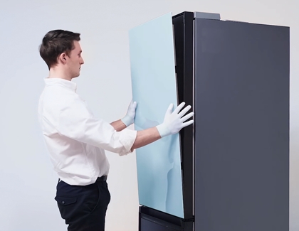 Person lining up the panels on the top fridge of BESPOKE