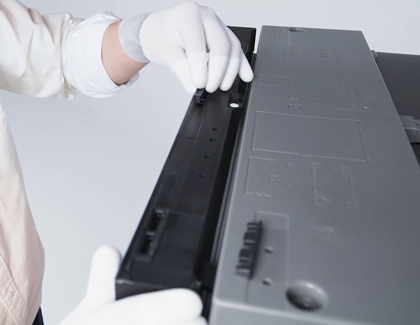 Person locking up the panels with a rectangular clips on top of the panel
