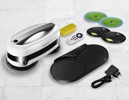 A Samsung Jetbot Mop with its included accessories, including mop pads, a charging dock, a remote control, a power adapter, and a cleaning brush