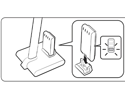 The vacuum battery being inserted into the charging stand