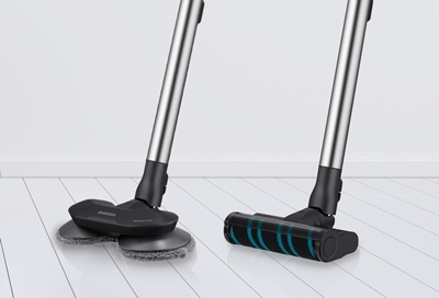 A Jet Stick Vacuum with the Wet Brush next to a Jet Stick with the Turbo Power Brush 