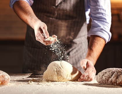 Adding salt on the dough for kneading