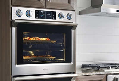 A Samsung wall oven with food cooking inside