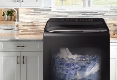 Transparent view of top load Samsung washer filling with water